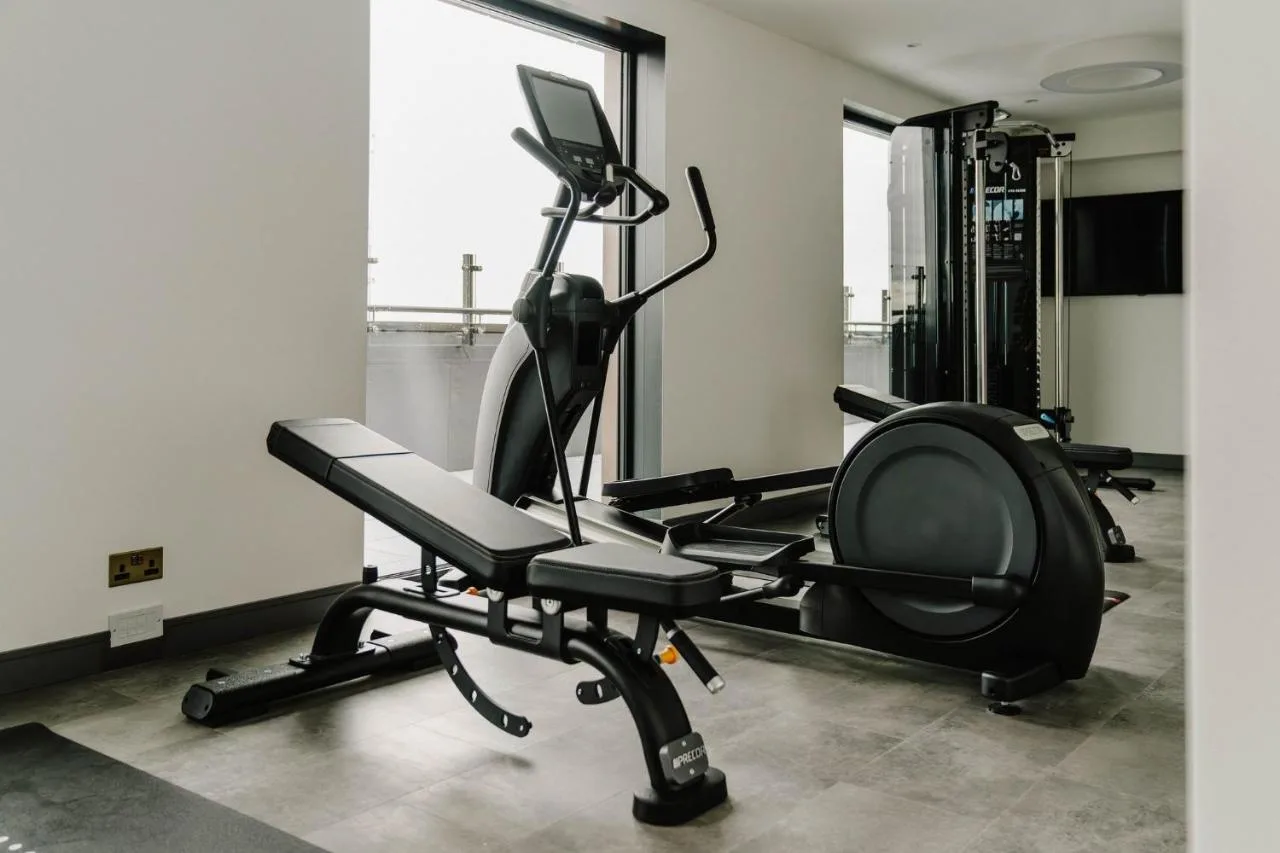 a room with a gym with a exercise bike at The Halyard Liverpool, Vignette Collection by IHG in Liverpool